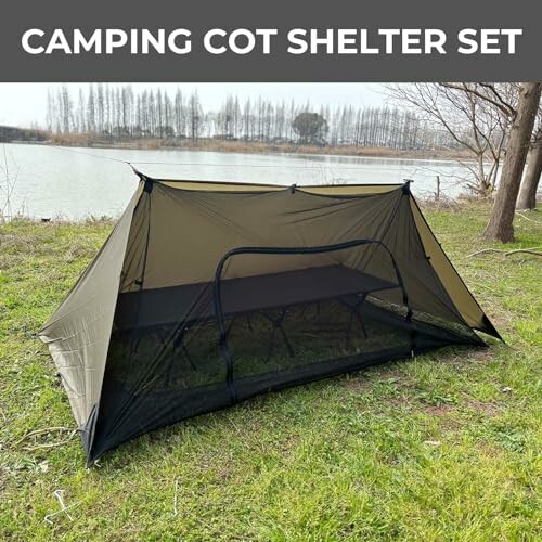 Camping cot shelter set near a lake