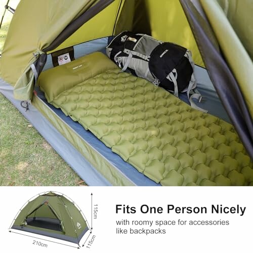 Compact one-person tent with air mattress and backpack inside.