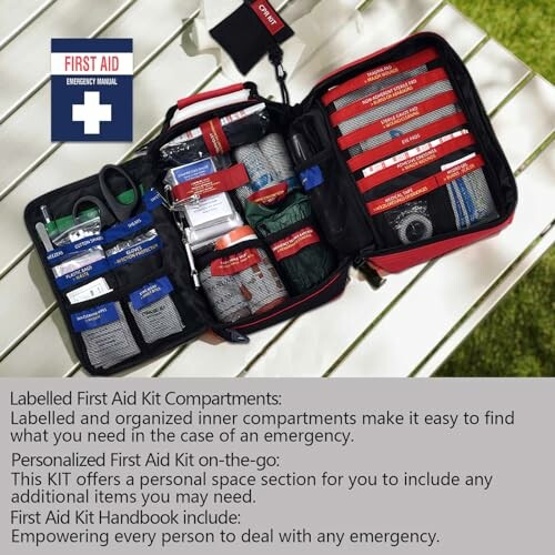 Open first aid kit with labeled compartments on a table.