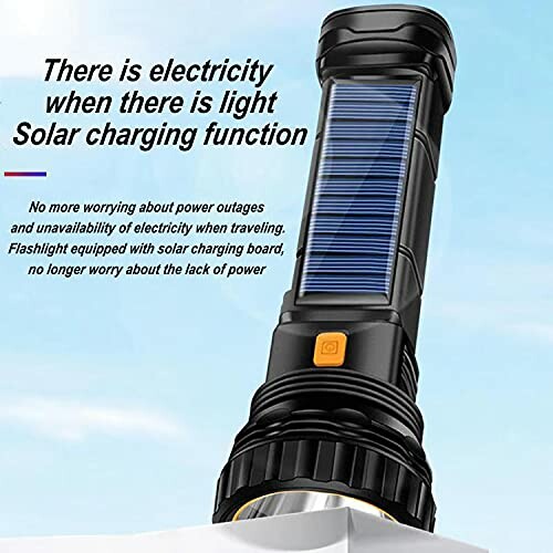 Flashlight with solar charging feature shown against a sky background.